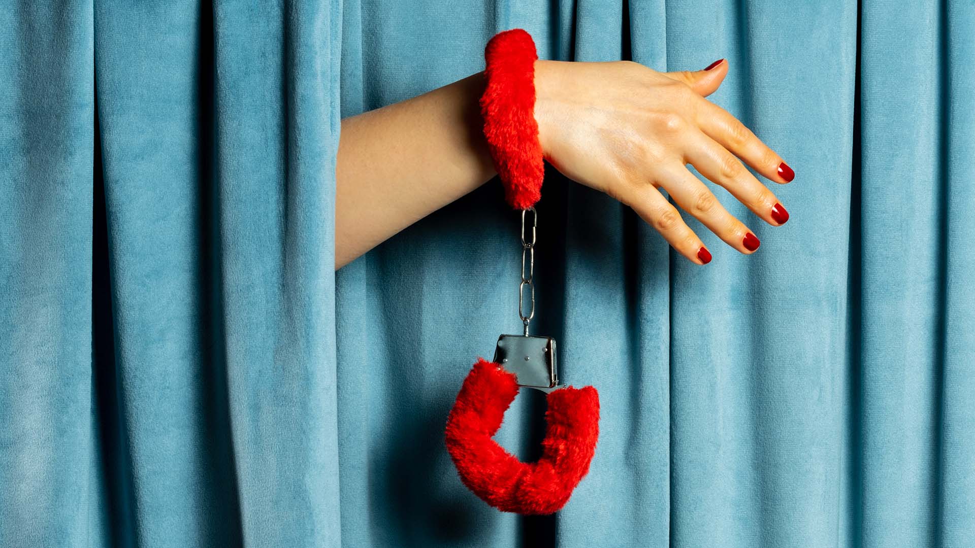 Woman with fluffy handcuffs
