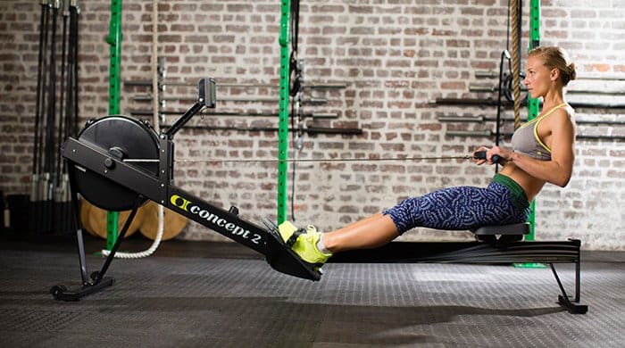 A woman burning kilojoules on a rowing machine