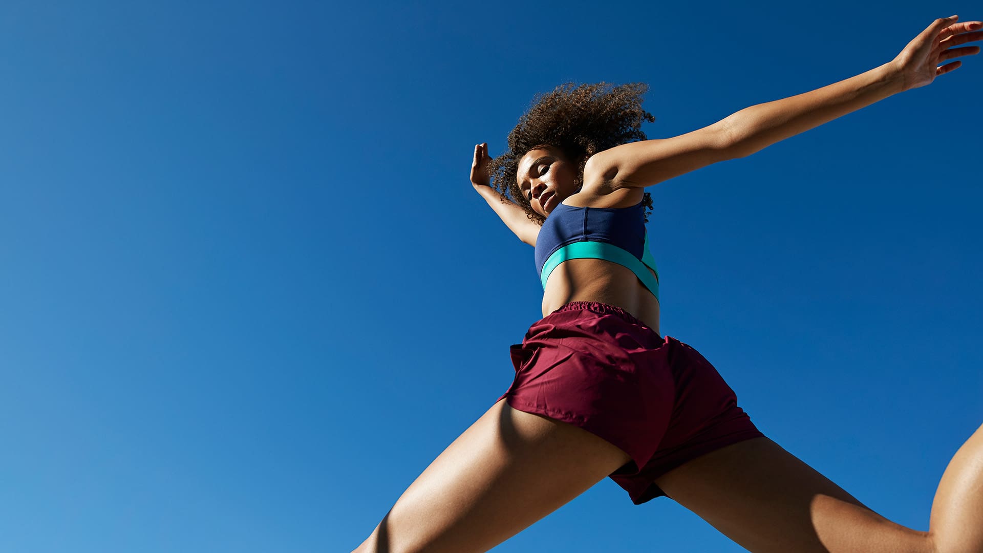 Young woman exercising and running