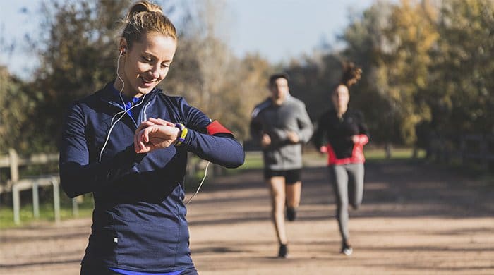 a woman checking her heart rate after her workout