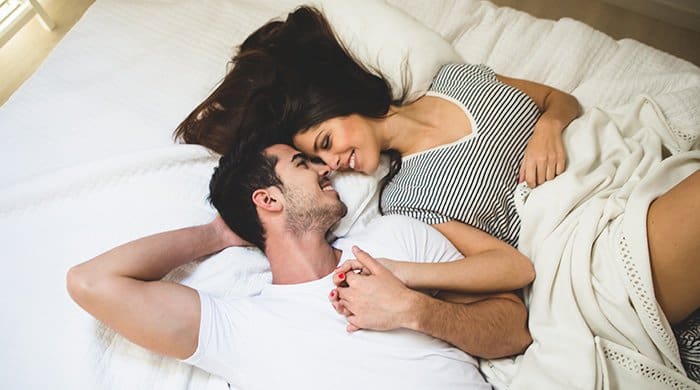Couple in bed after sex