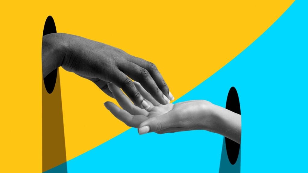 hand reaching out to touch another hand through yellow and blue backgrounds