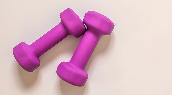 purple dumbbells which you need for strength training