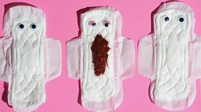 Sanitary pads on a pink background to represent periods