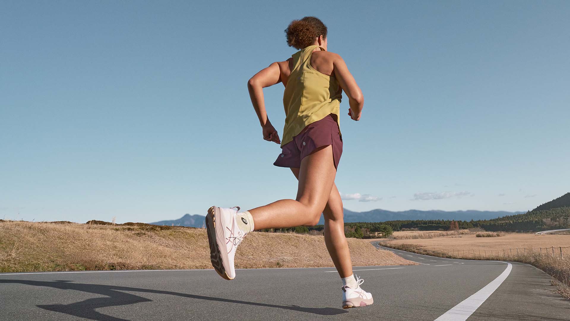 Woman running with the new ASICS Gel-Kayano-32
