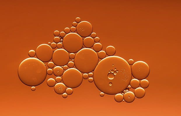 MCT oil on an orange background