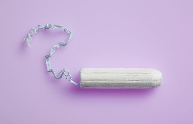 Tampon on a light purple background for a period related story