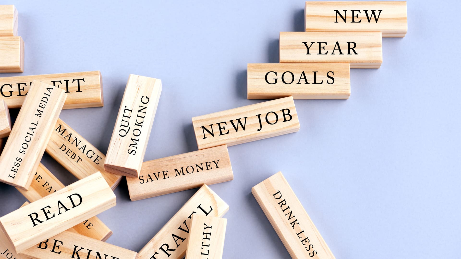 new year's resolution wooden blocks on a purple background