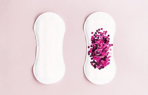 A pad with glitter to represent getting your period while pregnant