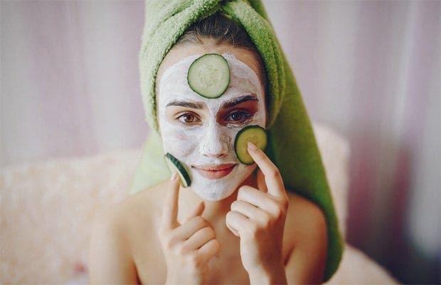 A woman applying DIY face masks
