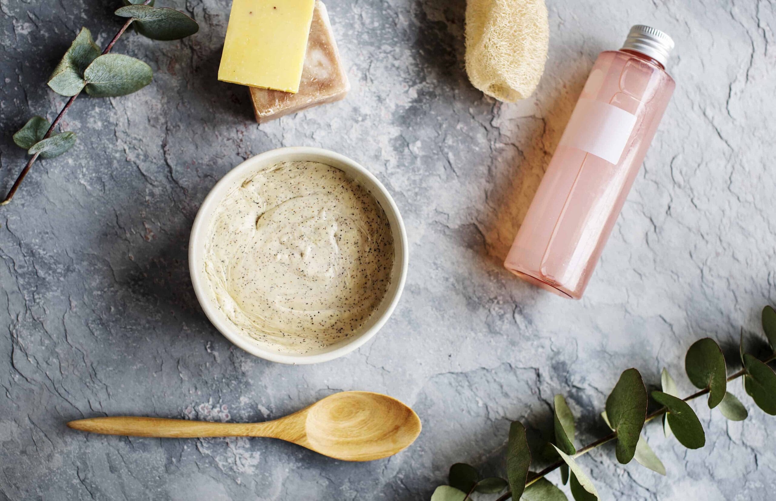 A flatlay of beauty spa products containing eucalyptus oil