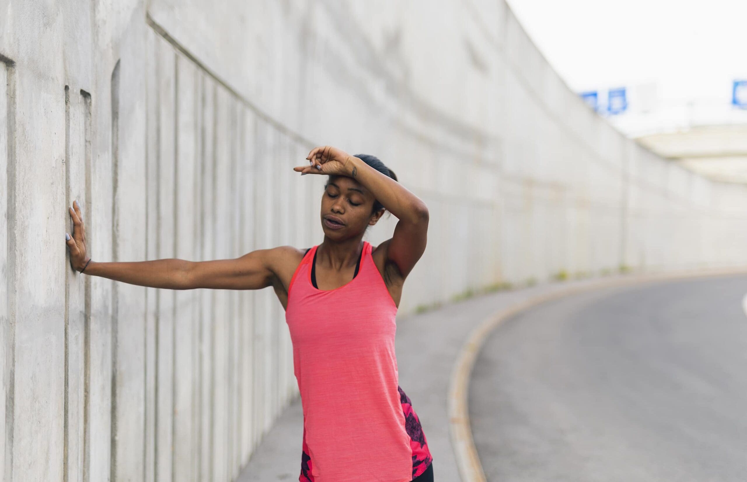 A woman with an exercise headache