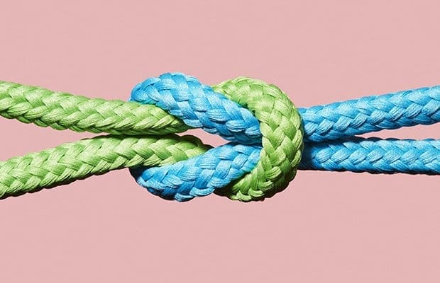 a brightly coloured knot against a pink background to represent attachment style