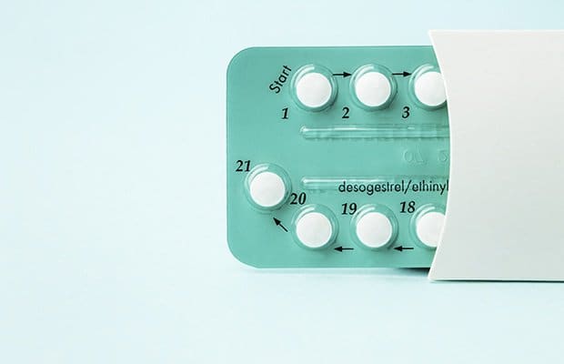 Pack of contraceptive pills with instructions. Blister in white case on blue background to represent birth control stories