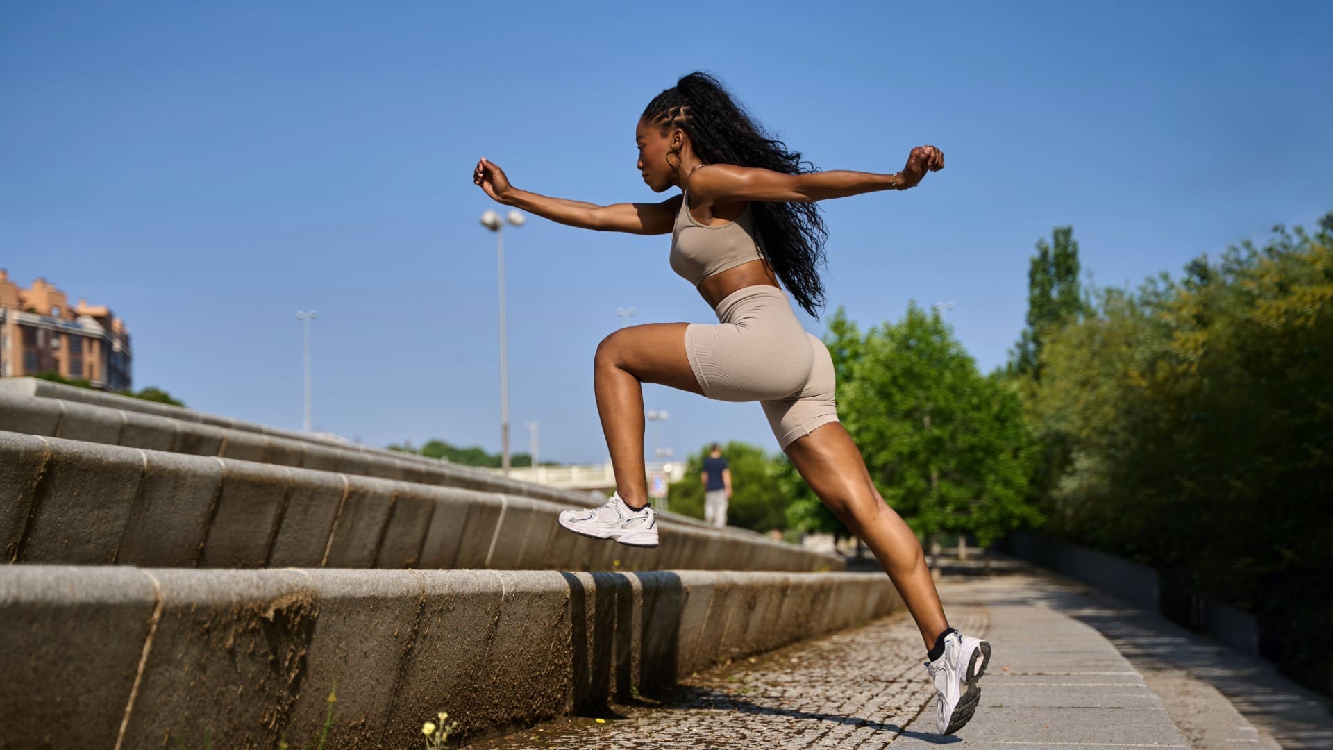 Woman outdoors doing outdoor no-equipment bodyweight workout