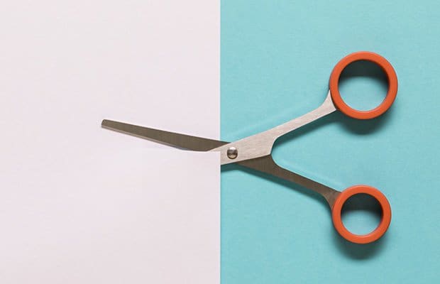 scissoring scissors cutting paper to represent a story about the scissoring sex position