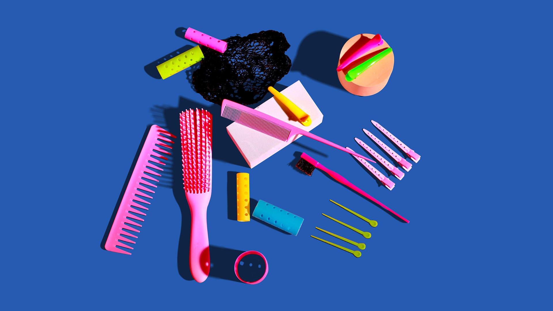 Multicoloured hair accessories on blue background