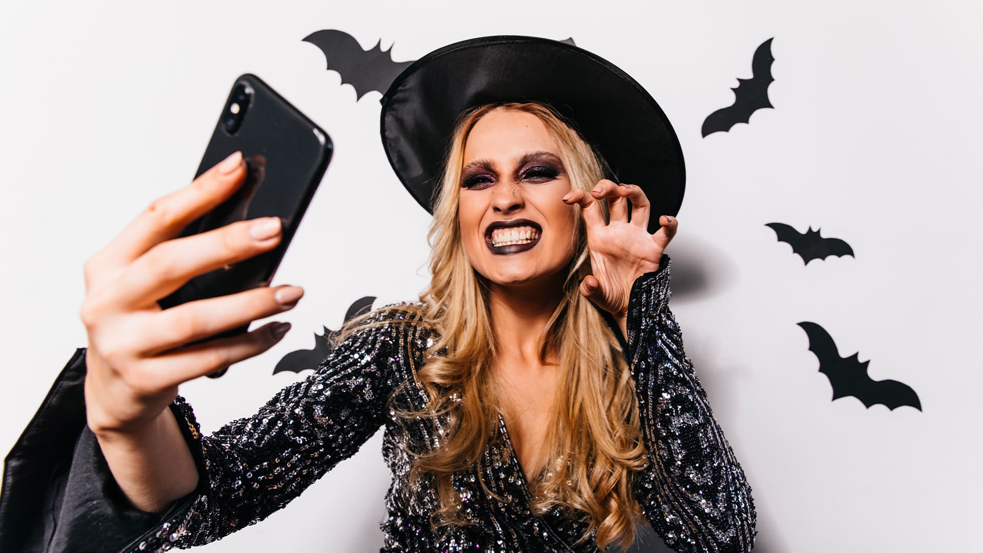 woman taking selfie with Halloween costume