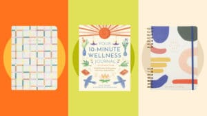 Three journals on a colourful background