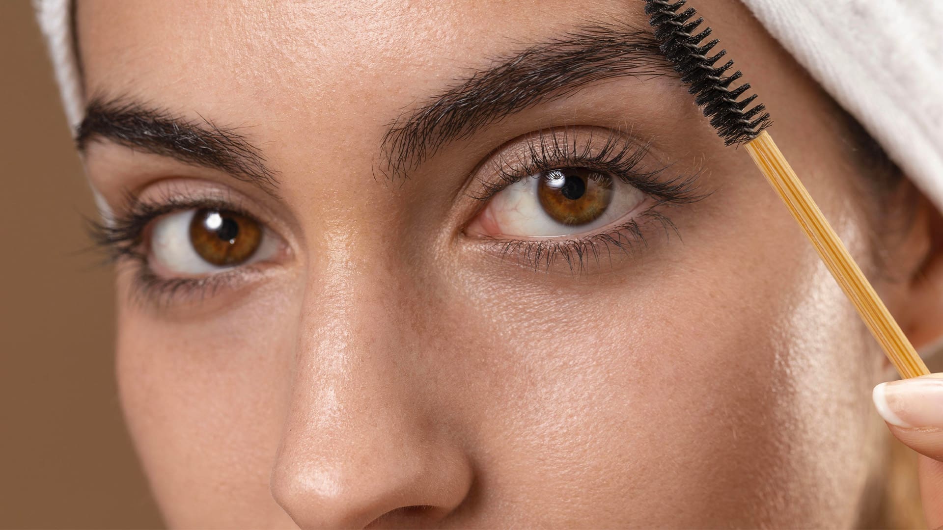 Woman taking care of her eyebrows