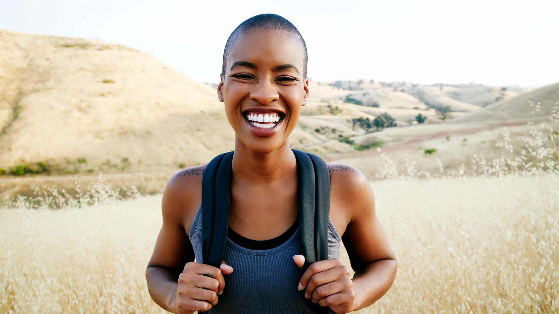 Health Benefits Of Getting Outdoors Happy woman hiking