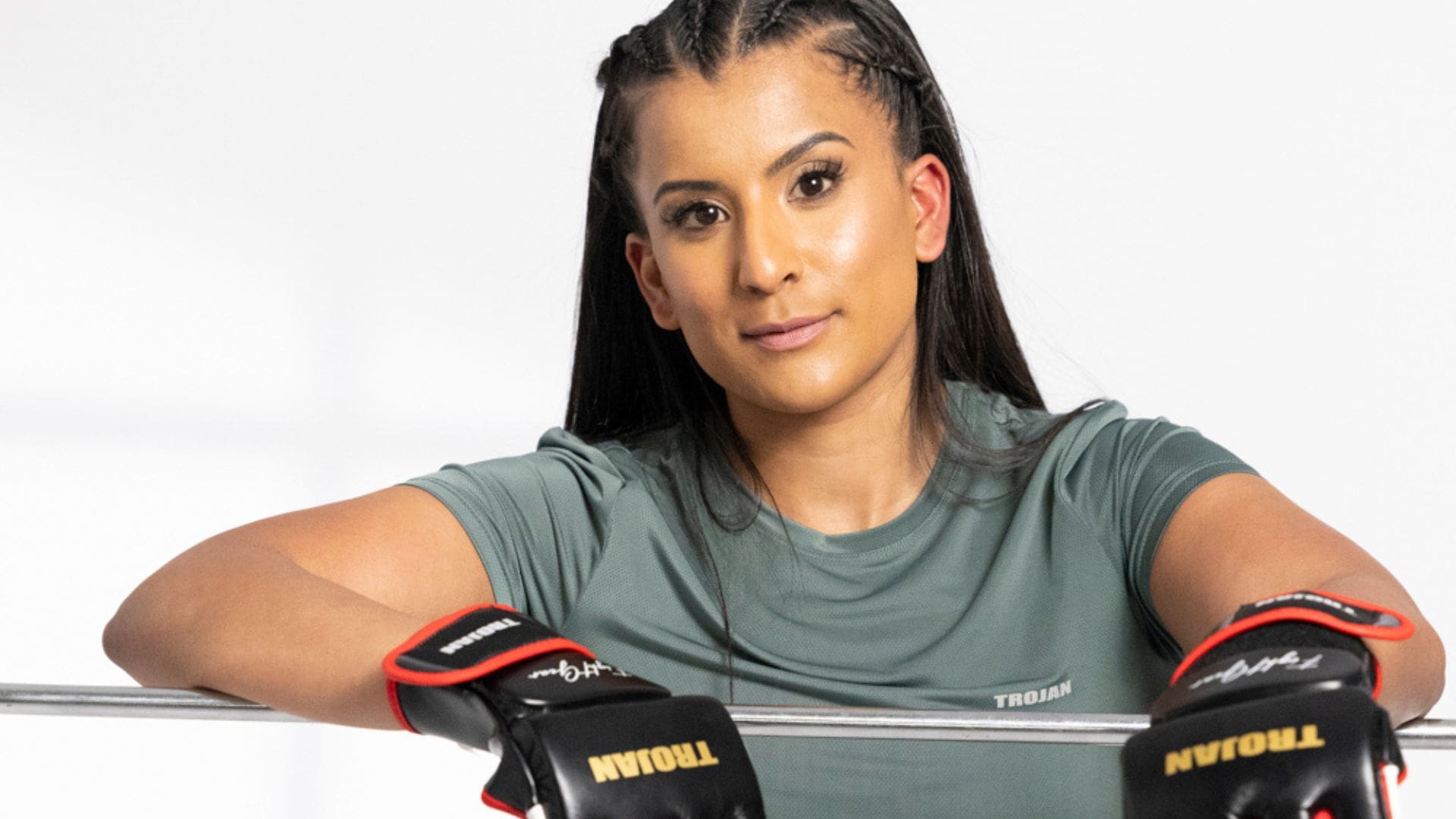 Indigo Haddington WH Cover Search finalist in green sportswear from Trojan and boxing gloves