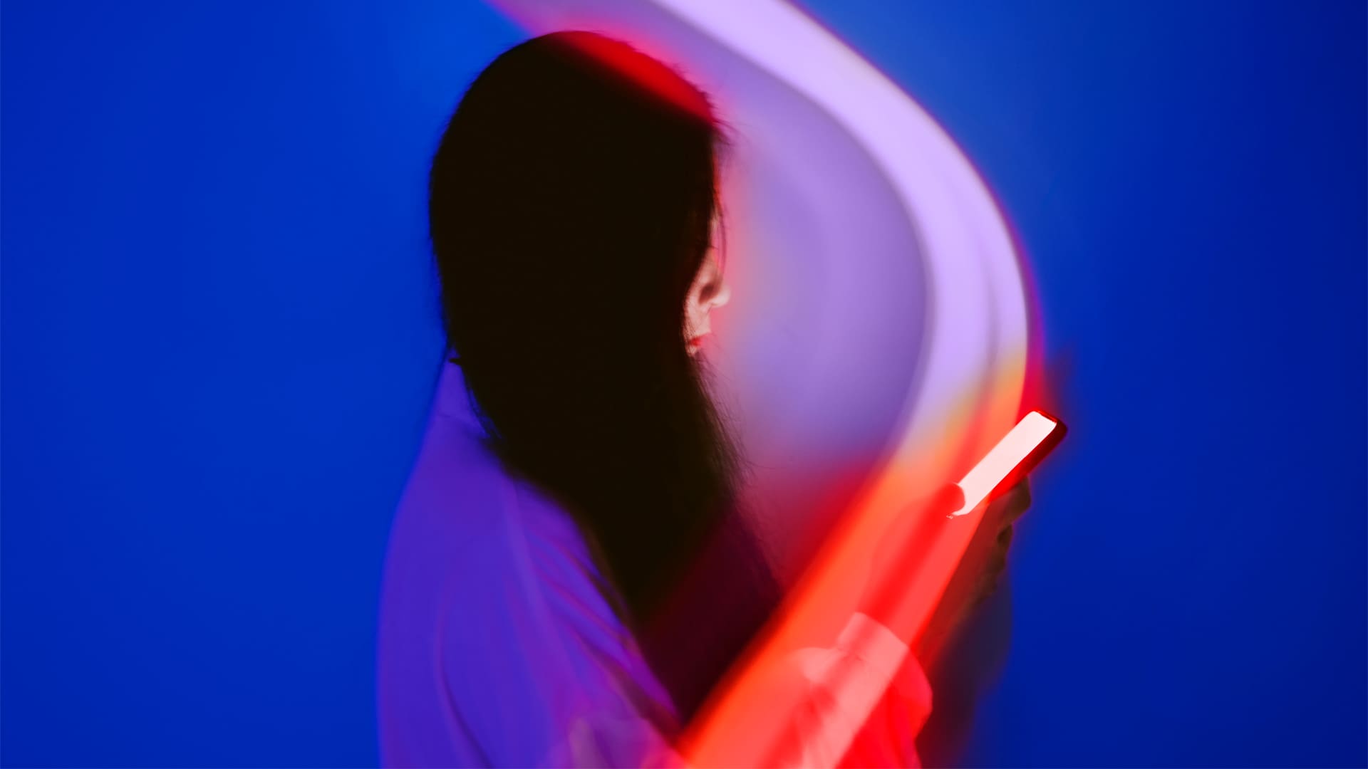 Woman on her phone conceptual photo