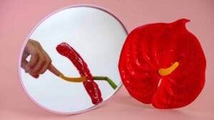 Woman touching flower, resembling masturbation