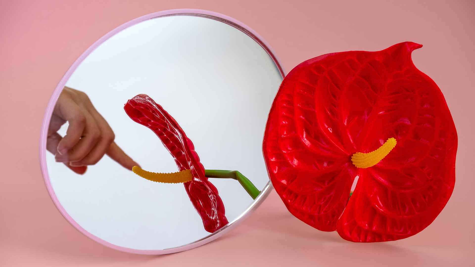 Woman touching flower, resembling masturbation