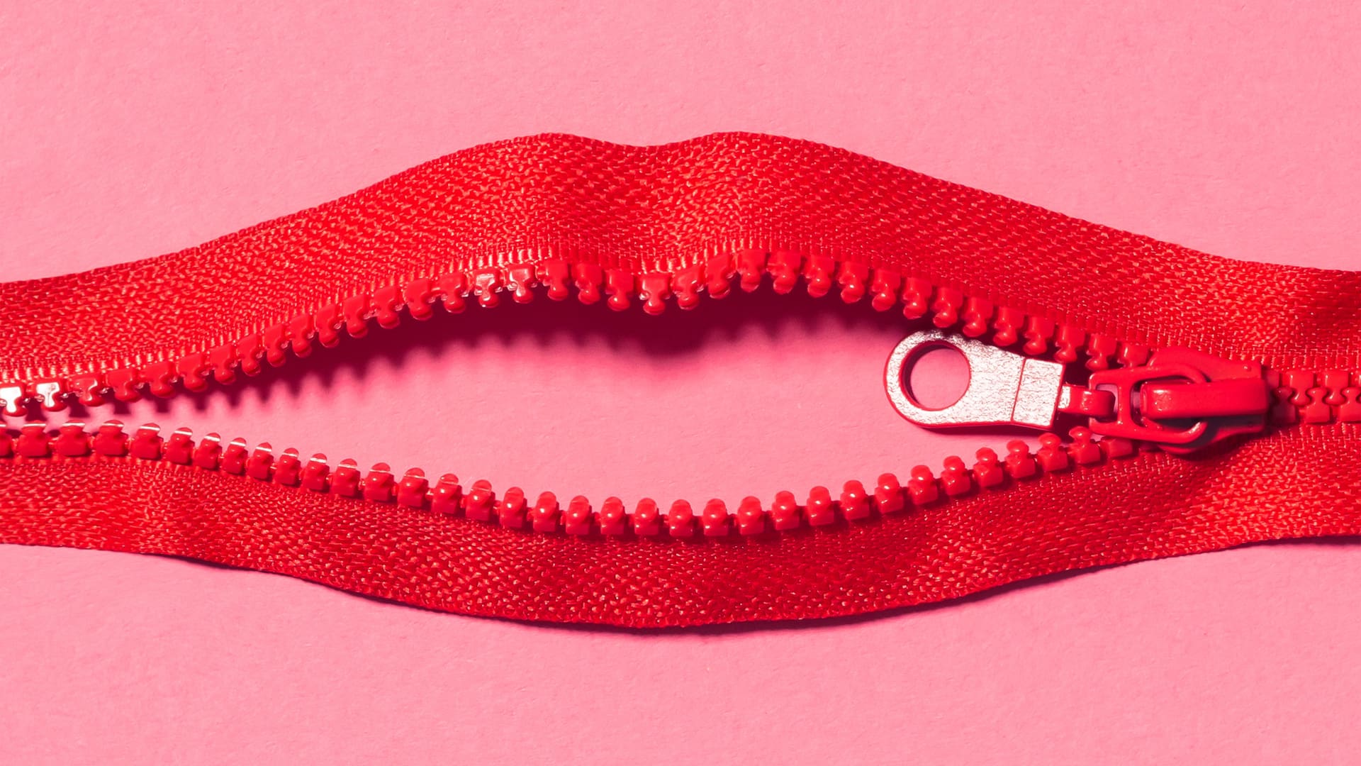 red zipper in the shape of lips on a pink background for audio erotica podcasts