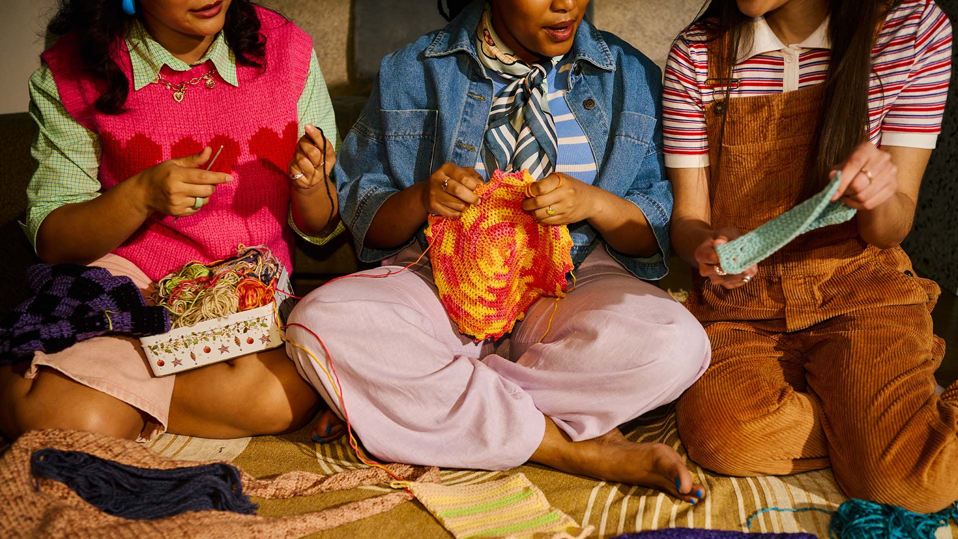 Young women enjoying analog knitting hobby