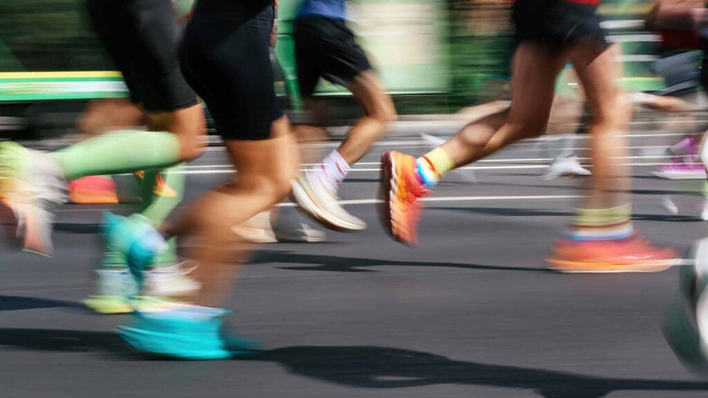 Blurred motion image of runners running through the city