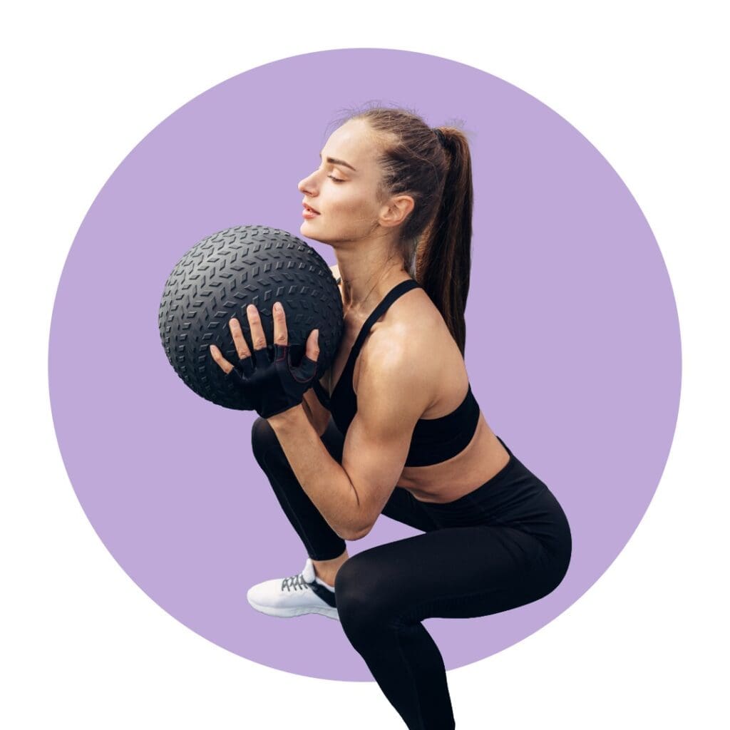 Woman doing weighted squat for fat loss
